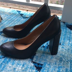 Black leather pumps with studded 4 inch heel